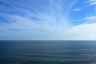 Scenic view of sea against blue sky