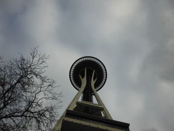 Low angle view of traditional windmill against sky