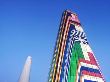 Low angle view of building against blue sky