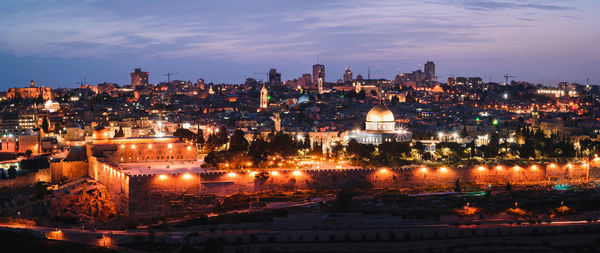 Illuminated buildings in city at night