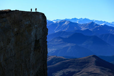 Scenic view of mountain range against clear blue sky