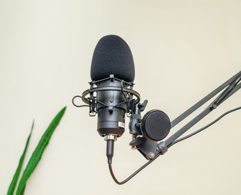 Close-up of microphone against white background