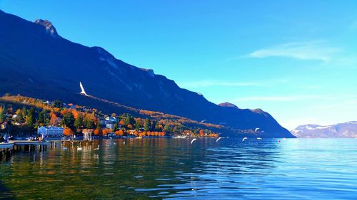 Scenic view of lake and mountains against sky