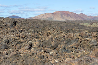 Scenic view of volcanic landscape against sky