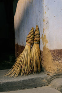 Close-up of brooms at house