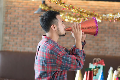 Young man enjoying during christmas party