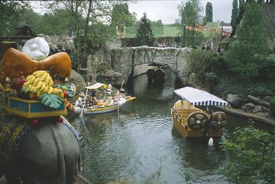 Rear view of people on boat in river