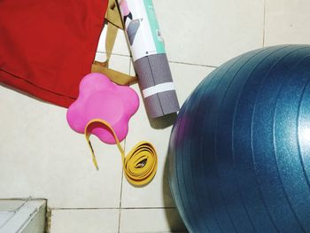 High angle view of multi colored umbrellas on tiled floor