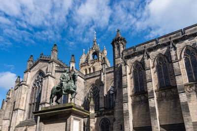 Low angle view of statue against sky