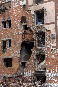Cities of ukraine after the russian occupation. destroyed buildings on the streets of irpen.