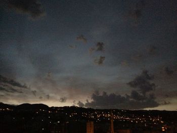 Scenic view of illuminated mountain against sky at night