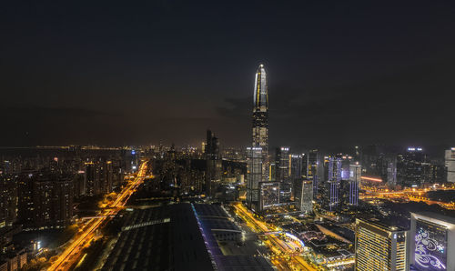 High angle view of illuminated buildings in city at night