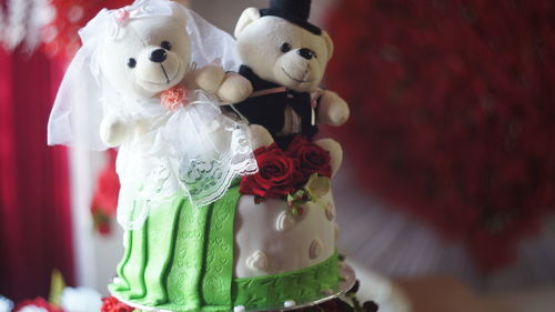 Close-up of teddy bears on cake