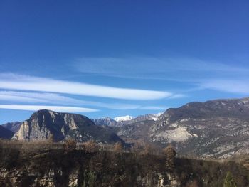Scenic view of landscape and mountains against sky