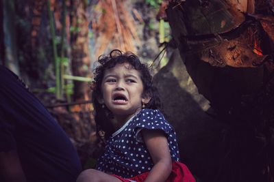 Portrait of cute girl in forest