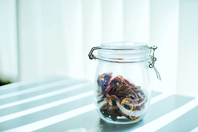 Close-up of drink in glass jar on table