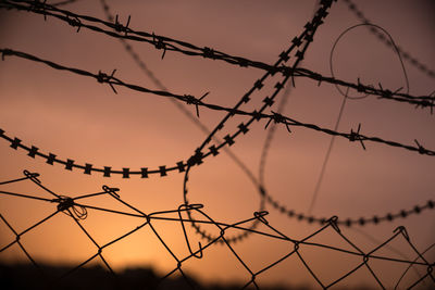 Barbed wire and sunset in bethlehem, land of palestinian and israeli issues