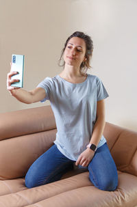 Young woman using mobile phone