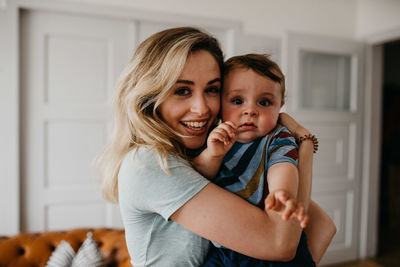 Happy mother with son at home