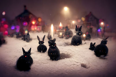 Close-up of christmas decorations on street at night