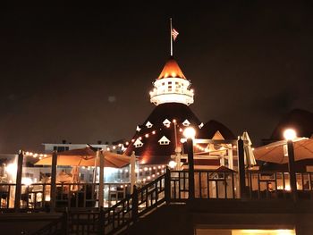 Illuminated building against sky at night