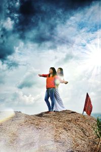 Full length of young man standing on rock