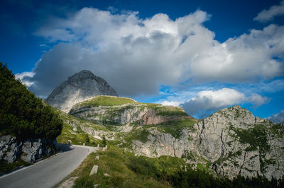 Scenic view of mountains against cloudy sky