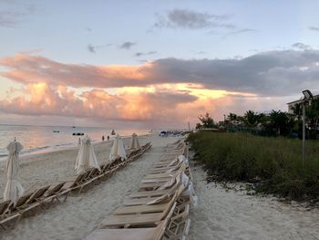 Scenic view of beach against sky during sunset