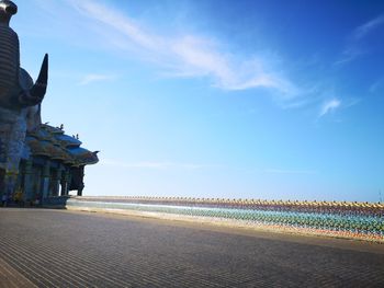 Statue of temple against blue sky