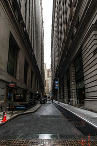 Street amidst buildings in city against sky