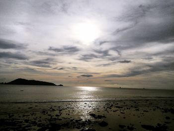 Scenic view of sea against cloudy sky