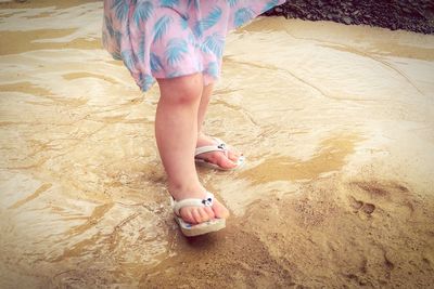 Low section of woman on beach