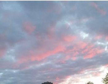 Low angle view of dramatic sky during sunset