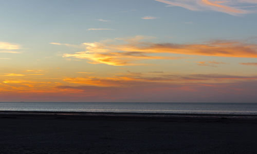 Scenic view of sea at sunset