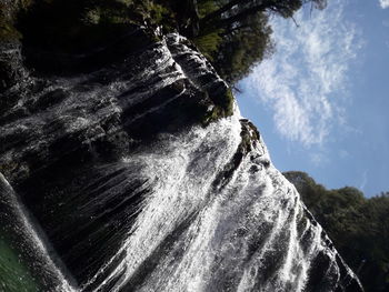 Low angle view of rock formation against sky