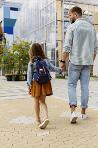 Father walking with daughter