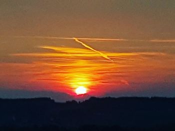 Scenic view of dramatic sky during sunset