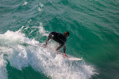 High angle view of man surfing in sea