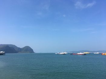 Scenic view of sea against blue sky