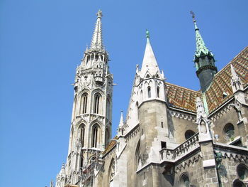 Low angle view of church against clear blue sky