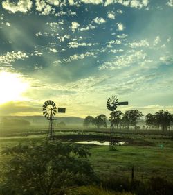Scenic view of field against sky during sunset