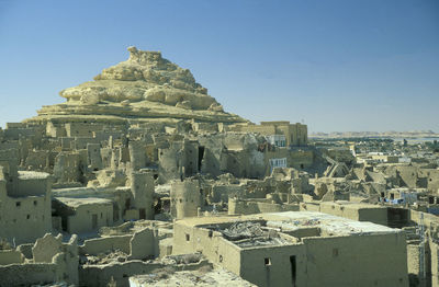 High angle view of townscape against clear blue sky