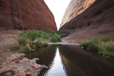 Stream flowing through rock formation