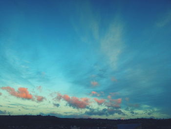 Scenic view of landscape against blue sky