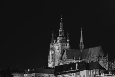 Low angle view of buildings against sky at night