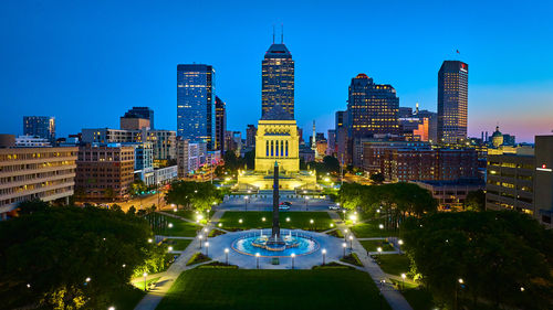 Illuminated buildings in city at night