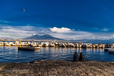 Scenic view of sea against blue sky