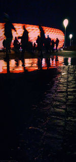 Group of people on street at night