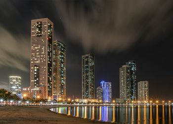 Illuminated buildings in city at night