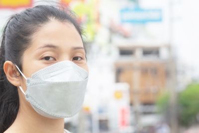 Woman wearing a mask to prevent dust and bacteria